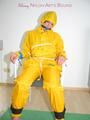 Katharina tied, gagged and hooded on a chair wearing sexy yellow rainwear (Pics)