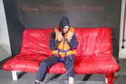 *** HOT HOT HOT*** NEW MODELL*** DESTINY wearing a sexy blue/red shiny nylon rain suit and a life jacket ties and gagges herself with cuffs on a sofa (Pics)