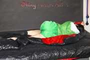 Lucy wearing sexy green shiny nylon shorts and a green rain jacket lolling on bed with a special cover (Pics)