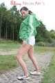 Watching ***OUR SEXY ARCHIVE MODEL JENNY*** wearing a sexy white shiny nylon shorts and a green shiny nylon rain jacket posing for you (Pics)