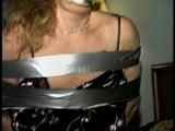 43 YEAR OLD WAITRESS IS TAPE HOG-TIED, BAREFOOT, TOE-TIED & WRAP TAPE GAGGED (D65-8)