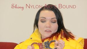 Jill ties, gagges and hoodes herself wearing a shiny yellow down jacket and a yellow rain pants(Pics)