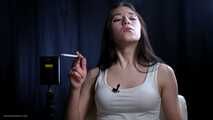 Brunette teen is smoking cork 100mm cigarette