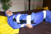 Lucy taped, hooded and gagged on bed wearing sexy blue rainwear (Pics)