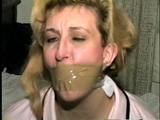 44 Yr OLD HOUSEKEEPER ON SCREEN HOG-TYING, MOUTH STUFFING, FEET AND LEG TAPE TYING WEARING PANTYHOSE, & WRAP TAPE GAGGING (D56-13)