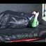 Lucy wearing a green shiny nylon shorts and a green rain jacket lolling on bed (Video)