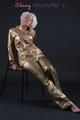 Blonde archive girl posing in a studio wearing a sexy golden rainwear combination (Pics)
