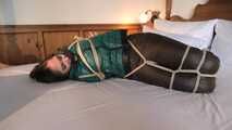 Rachel Adams tied and gagged in shiny Downwear