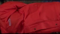 Jill tied, gagged and hooded on a princess bed wearing shiny orange rainwear (Video)