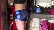 Watching sexy COURTNEY wearing a darkblue shiny nylon shorts and a top while preparing coffee and doing her housework (Video)