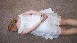Cuffed in a white dress