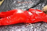 Sophie ties and gagges herself in a shiny red PVC saunasuit (PICS)