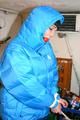 Jill tied and gagged in a refrigeration room wearing a blue shiny nylon down jacket and a black rain pants (Pics)