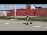 Stella during inline skating wearing shiny nylon shorts and rain jacket (Video)