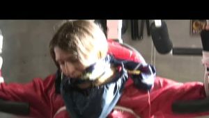 02:50 Min. video with Katharina tied and gagged in shiny nylon rainwear