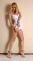 Dolly: blonde barefoot girl, wearing white body underwear, poses free, and then with handcuffs and leg irons on
