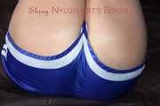Watching sexy Pia wearing a supersexy blue shiny nylon shorts and a top being tied and gaggedoverhead with ropes and a clothgag (Pics)
