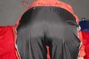 SONJA wearing a very special red shiny nylon jacket and a black shiny nylon pant sorting shiny nylon shorts (Pics)