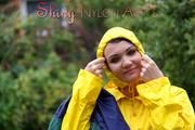 Jill Diamond in the garden playing with water out of the garden hose wearing supersexy shiny nylon rainwear and a rain cape (Pics)