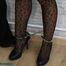 Leather lady cuffed to the heater