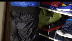 Pia wearing a sexy dark blue rain pants and a sexy down jacket while arranging the shiny nylon clothes (Video)
