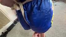 Watch Marie bound and gagged in a shiny nylon Shorts
