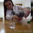 A hot chick with a suitcase makes a drinking test