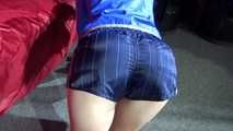 Watching sexy Sonja wearing a supersexy oldschool blue shiny nylon shorts and a lightblue rain jacket during her workout with barbells (Video)