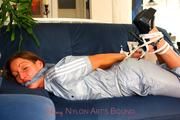 Stella bound and gagged in a shiny nylon jumpsuit