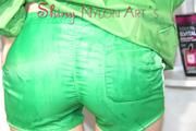 Sonja oiling and rinsing herself in the shower wearing a supersexy green shiny nylon shorts and rain jacket (Pics)