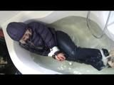 03:00 Min. video with Nina tied and gagged in a shiny nylon downjacket