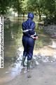 Stella bound outdoor in a blue rainsuit