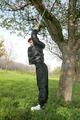 Jill tied and gagged outdoor on a tree wearing a sexy black downjacket and a black rain pants (Pics)