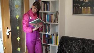 Mara wearing a sexy oldschool shiny nylon downwear combination reading and lolling on the sofa (Video)