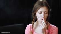 Watch the beauty with crystal blue eyes smoking a 120mm cigarette in her fresh video