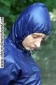 Stella bound outdoor in a blue rainsuit