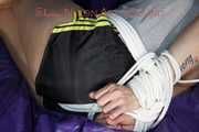 Pia being tied and gagged on a sofa with ropes and a cloth gag wearing a sexy shiny nylon shirts and a tshirt (Pics)
