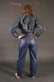 Alina posing in a studio wearing a supersexy darkblue rainwear combination (Pics)