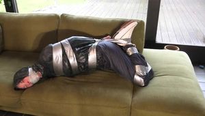 Myxxxy broke into the wrong house and get cought by another intruder, which ties and gagges her in different positions in shiny nylon rainwear