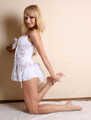 Dolly: blonde barefoot girl, wearing white body underwear, poses free, and then with handcuffs and leg irons on