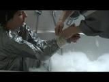 Simone  with an shiny silver PVC sauna suit tied and gagged by Sophie in an bath tub (Video)