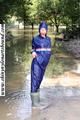 Stella bound outdoor in a blue rainsuit