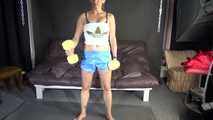 Watching sexy Sandra wearing a sexy lightblue shiny nylon shorts and a white top during her workout with barbells (Video)