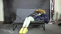 Marie bound and gagged in a shiny nylon Downjacket