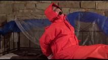 Jill tied, gagged and hooded on a princess bed wearing shiny orange rainwear (Video)
