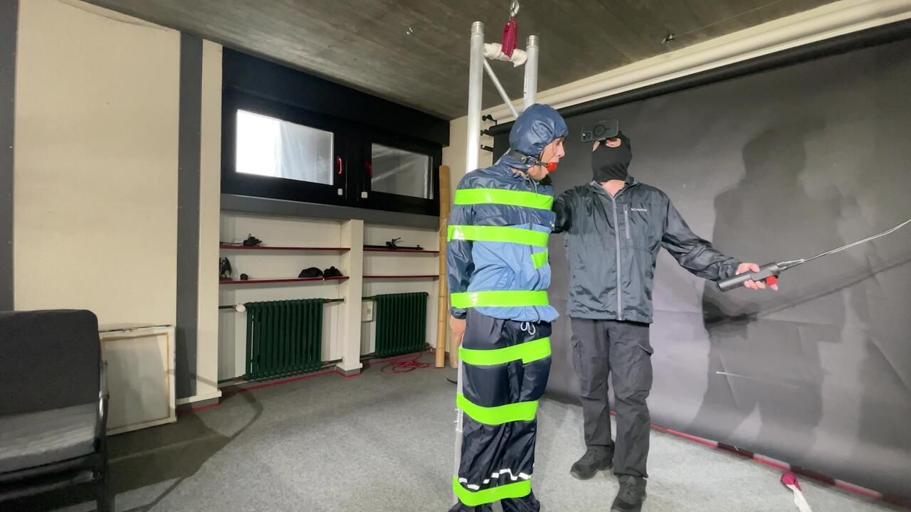 Marie M Tied, Gagged And Suspended In Shiny Nylon Rainwear