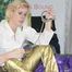 Pia ties and gagges herself on a bed wearing a supersexy golden rainwear combination (Pics)