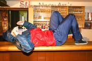 Jill posing in a bar wearing ONLY a sexy rainwear combination (Pics)