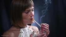 34 years old lady is smoking cork 100mm cigarette