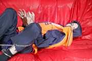 *** HOT HOT HOT*** NEW MODELL*** DESTINY wearing a sexy blue/red shiny nylon rain suit and a life jacket ties and gagges herself with cuffs on a sofa (Pics)